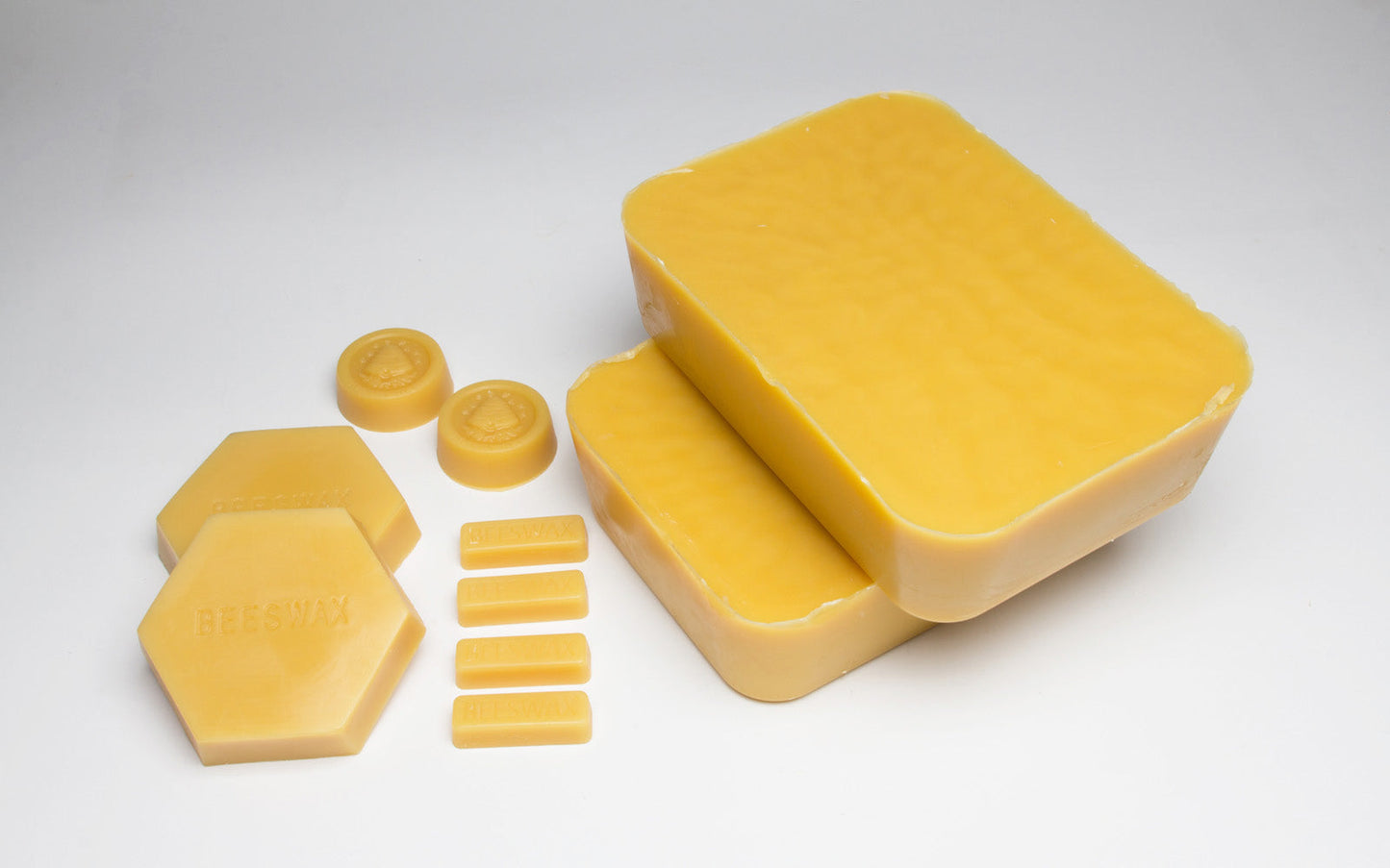 Various sizes of bulk beeswax.